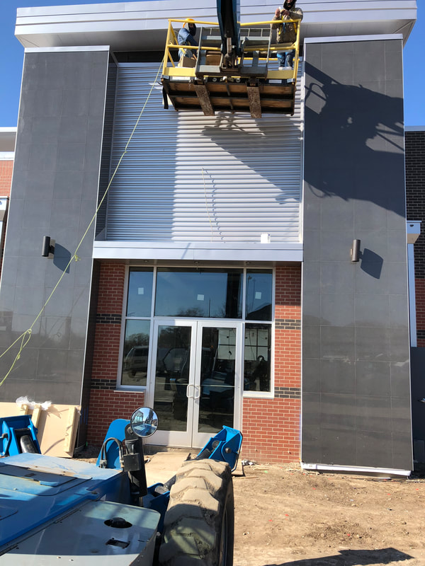 Jiffy Trip Wall Panels — commercial roofing project by American Roofing