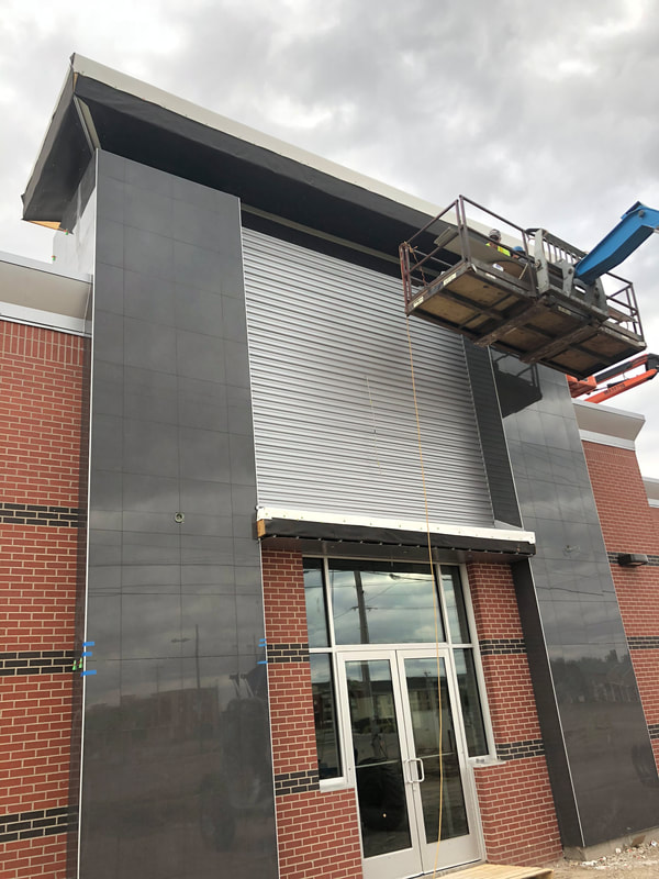 Jiffy Trip Wall Panels — commercial roofing project by American Roofing