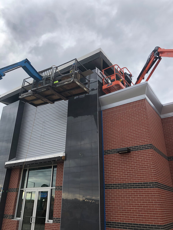Jiffy Trip Wall Panels — commercial roofing project by American Roofing