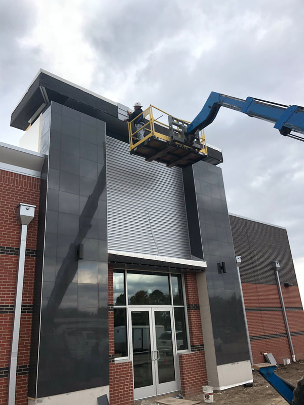 Jiffy Trip Wall Panels — commercial roofing project by American Roofing