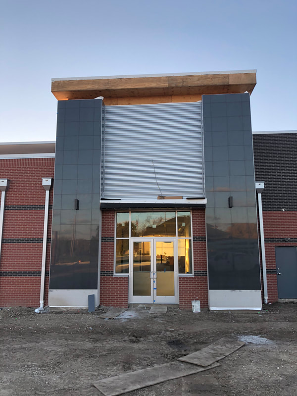 Jiffy Trip Wall Panels — commercial roofing project by American Roofing